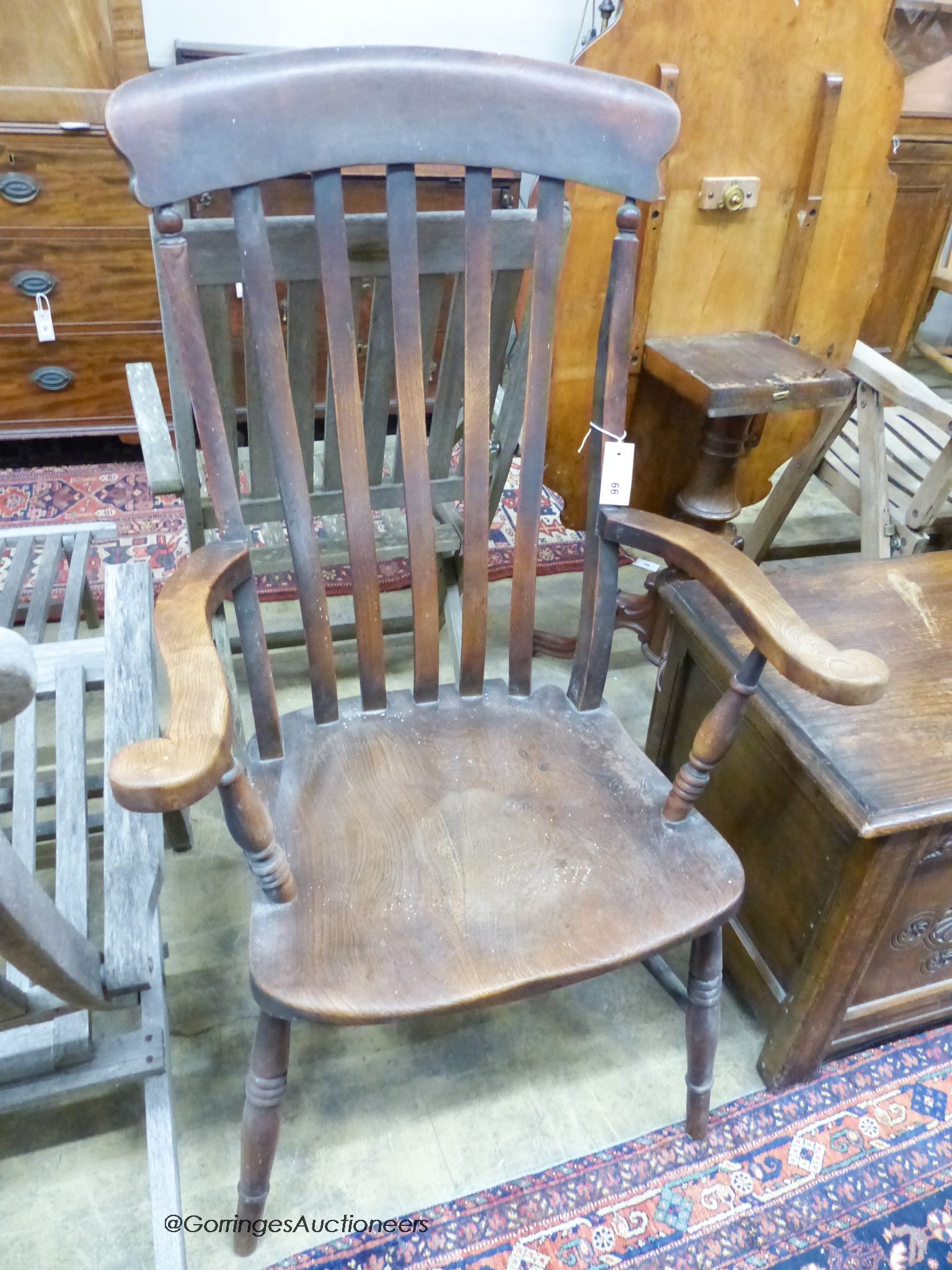 A 19th century beech and elm lathe back Windsor armchair